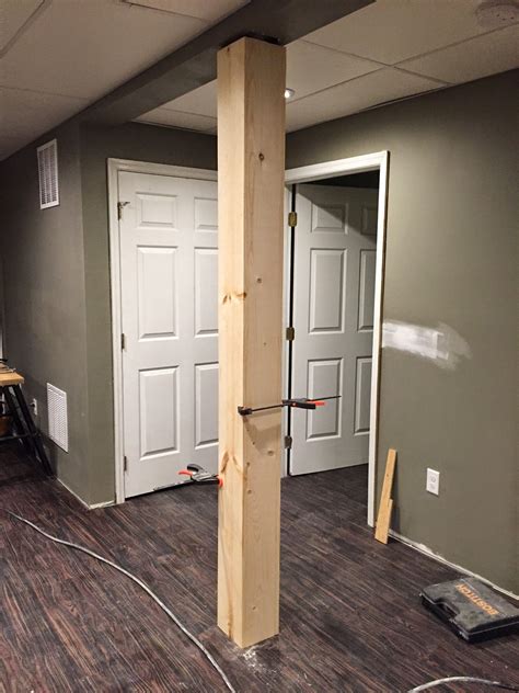 how to build box pillars around metal pole|basement shelf pole wrap ideas.